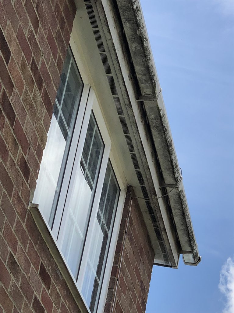 A dirty gutter and fascia